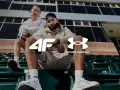 Para sportowców w strojach Under Armour, marki znanej z innowacyjnej odzieży sportowej.