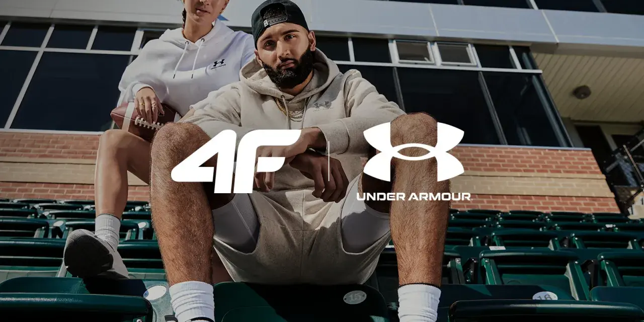 Para sportowców w strojach Under Armour, marki znanej z innowacyjnej odzieży sportowej.