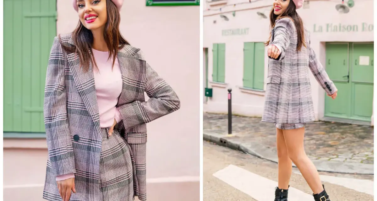 Dziewczyna w różowym beretce i kraciastej marynarce z mini spódniczką, prezentująca styl preppy na tle paryskiej uliczki.