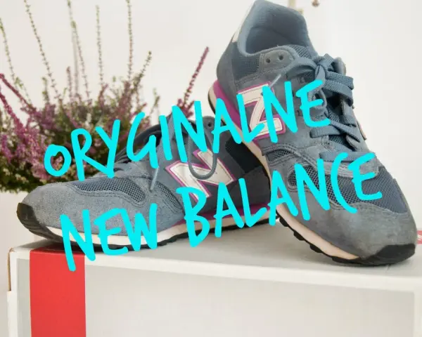 Szare buty New Balance, czy sizeer ma oryginalne buty? Na zdjęciu widać parę szarych sneakersów z fioletowymi i białymi akcentami.