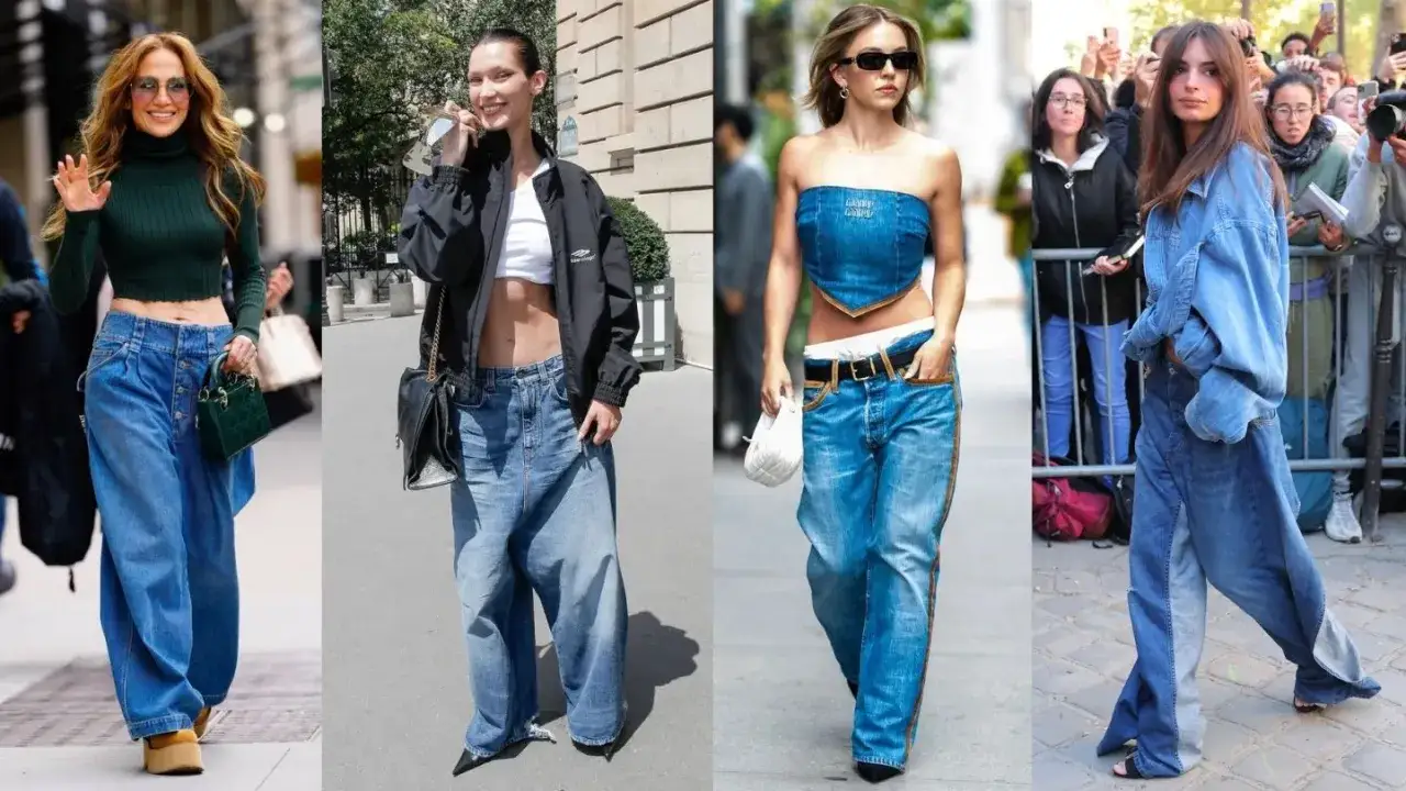 Cztery dziewczyny w stylu downtown girl w szerokich jeansach i krótkich topach. Modne stylizacje na ulicach miasta.